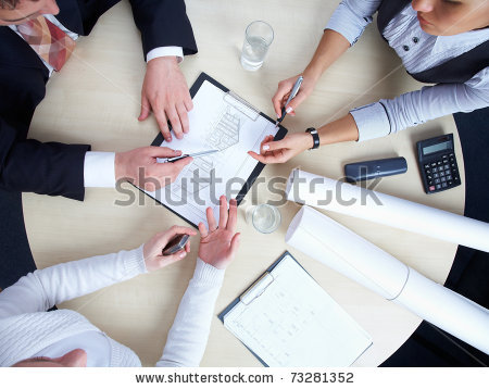 stock-photo-three-colleagues-are-discussing-a-round-table-draft-house-73281352